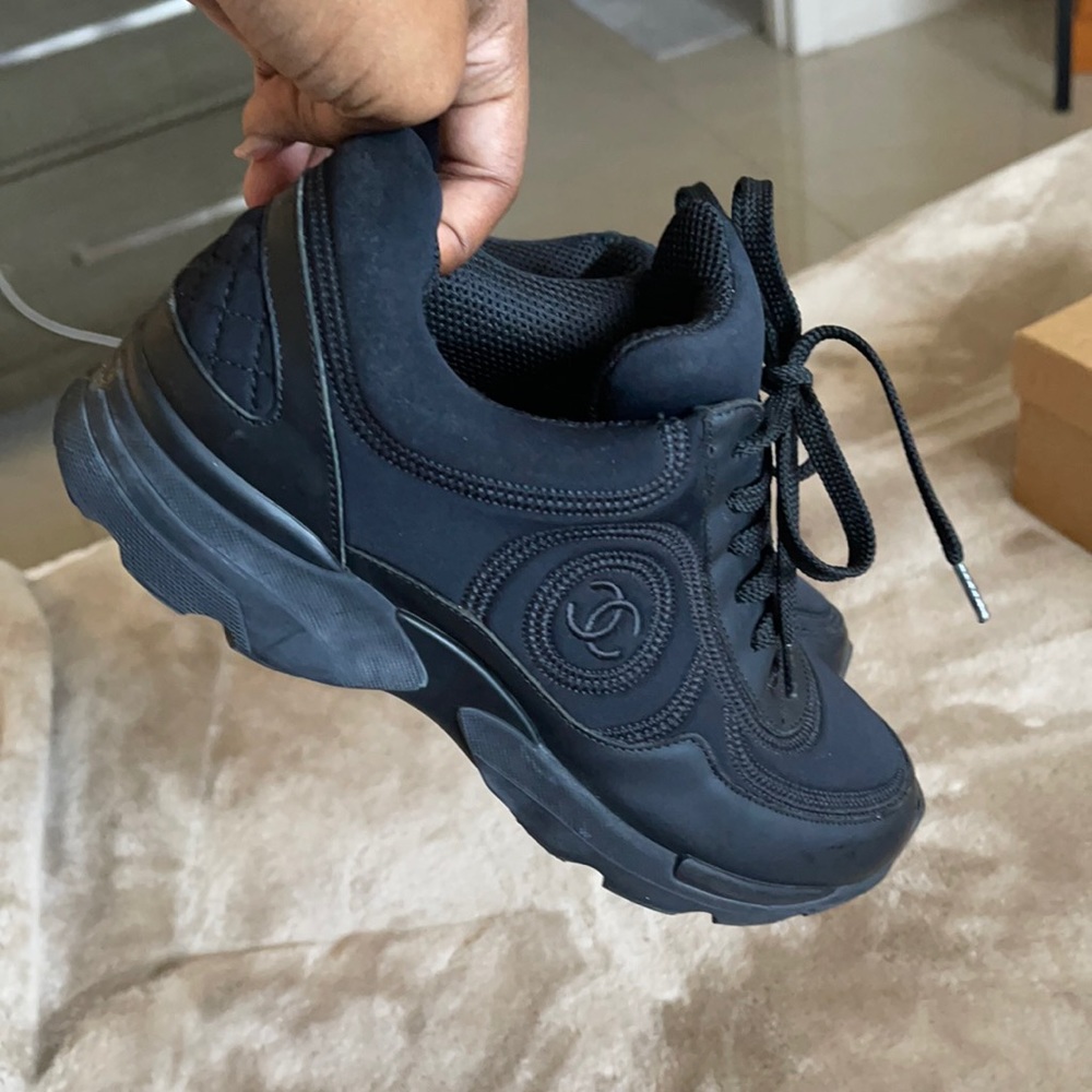 Women’s black Chanel sneakers